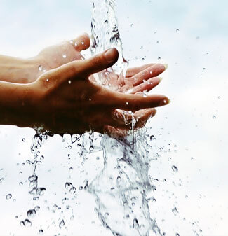 water flowing over hands